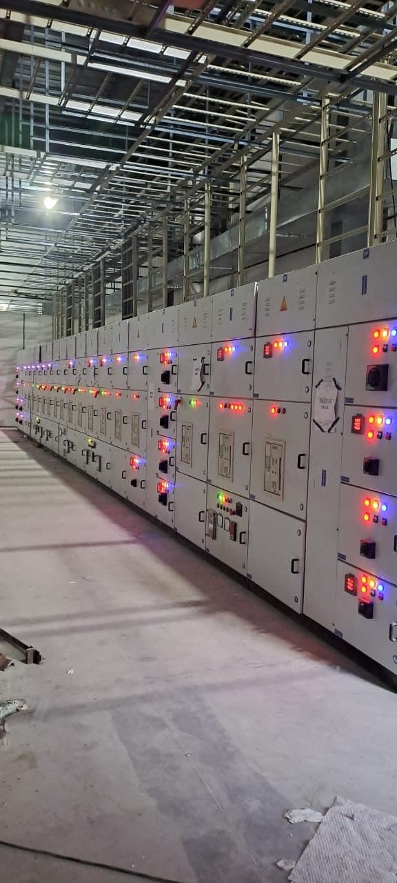 Long MCC line-up with indicator lamps lit during testing