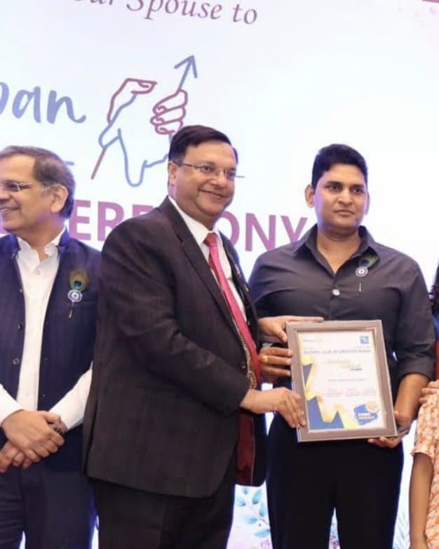 Director Pramod Kumar receiving a Rotary Club of Greater Noida certificate for contributions to social welfare